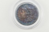 1885-O Rainbow Morgan Silver Dollar