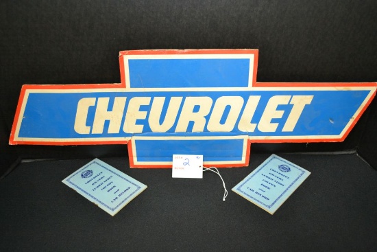 Group of Chevrolet coupon books and cardboard sign 22" X 8"