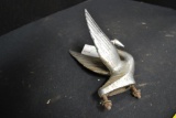Swan hood ornament pitted metallic chrome