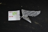 Winged ornament marked HM