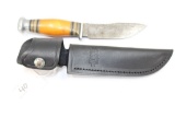 Custom made knife with a buck knife leather sheath, 8 1/2