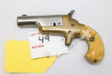 Single Shot pocket pistol, bone grip, brass frame, SS swing out barrel for loading, approx. .38cal r