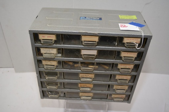 projectiles and brass in cabinet