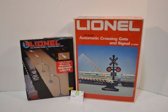 Pr of Lionel 027 highway lights no.12804 and automatic crossing gate and signal no.2162