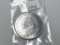 Three Packages of Mini Currency $1, $5, $10 and a $20 Bill; x's the Bid