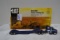 Pair of Tractor Hauling Truck and Trailers including Ertl CAT Challenger 65 1/64 Scale (NIB) and Ert