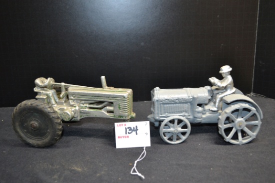 Pair of Toy Tractors including McCormick-Deering Cast Iron Steel-Wheeled Tractor w/Man and Aluminum