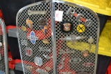Car Grill w/Large Assortment of Car Badges and Emblems including Pontiac, Chevrolet, REO, Ford, Tori
