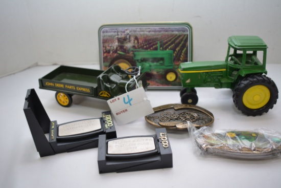 1 Lot of John Deere Memorabilia including 3 Pocket Knives, Toy Tractor, Belt Buckle, and Dain Truck