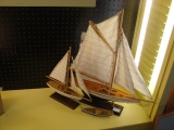 Three small model sailboats