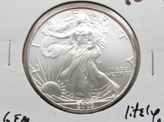 2009 Silver American Eagle Gem BU lightly toned
