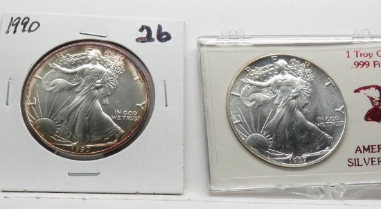 2 Unc Silver American Eagles: 1987 plastic holder, 1990