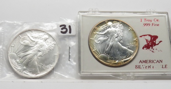 2 Unc Silver American Eagles: 1986, 1990 attractive toning plastic holder