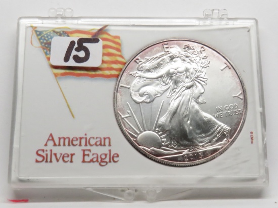 2013 Silver American Eagle in Case BU with rosy obv toning started