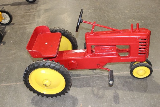 John Deere style pedal tractor painted red, open front grill, 31" long x 16