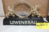 Lownbrau lighted electric clock.