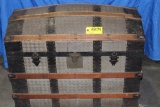 Domed top steamer trunk.