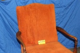 Ornage upholstered wooden arm chair.