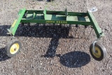 John Deere front mount tine type thatcher.