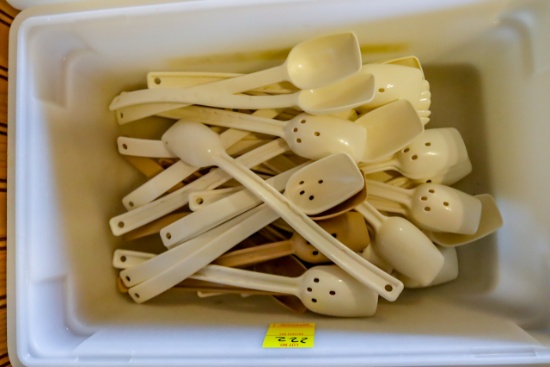 Tote of salad bar serving spoons, plastic