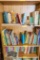 Childrens Golden Treasury and other children's books on 3 shelves