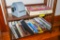Walt Disney and other books on bottom 2 shelves of book shelf, rolodex