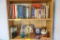 Books and décor on top 2 shelves