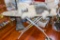 Metal Ironing Board and Shaggy Dog