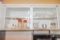 Pyrex clear measuring bowls (3) Fire King measuring cups and other items in cabinet