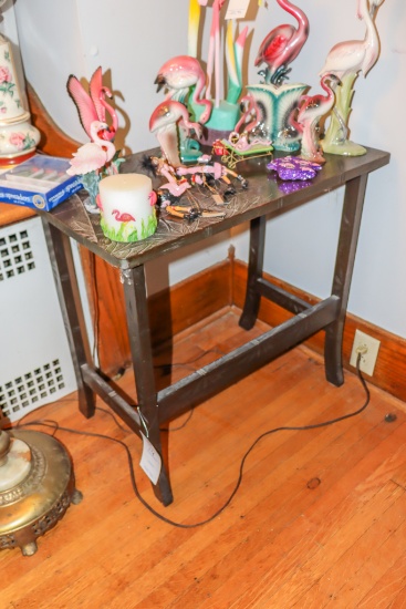 Side table with ornate carving on top (no contents)