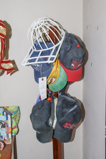 Assortment of Baseball caps and cap holder