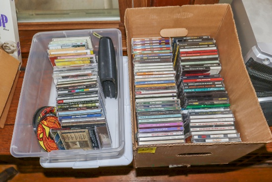 2 boxes of CDs (some empty CD cases)