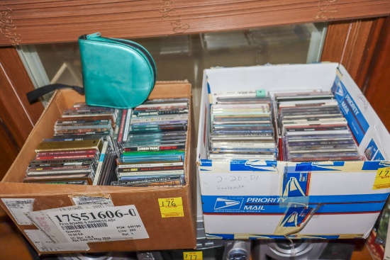 2 boxes of CDs (some empty CD cases)