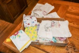 Flat of Needlepoint and vintage towls and apron