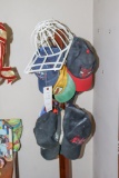 Assortment of Baseball caps and cap holder