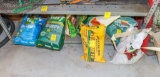 Large group of fertilizer and seed, seed spreader / Many are not opened