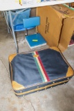 Vintage suitcase and stadium seat