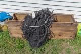 Large wooden box with black nylon netting