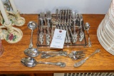 Stainless silverware in unique glass carrying tray