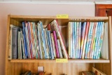 Walt Disney Gallery Books and other books on top shelf