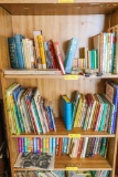 Childrens Golden Treasury and other children's books on 3 shelves