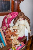 Porcelain face doll and wreath