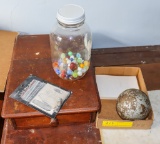 Marbles and large metal ball