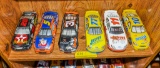 6 Nascar and racecars on shelf