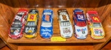 6 Nascar and racecars on shelf