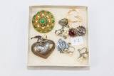 Ladies gold and silver earrings, locket and brooch
