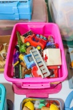 Fisher Price and other small toys in tote