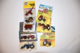 (8) Assortment Of Ertl 1/64th Scale Tractors And Implements On Cards