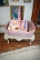 Small Plastic Bench With Wicker Basket And Assortment Of Child And Doll Magazines And Books