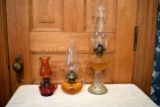 (3) 2 Finger Kerosene Lamps, And 1 Regular Kerosene Lamps, All Three Have Chimneys